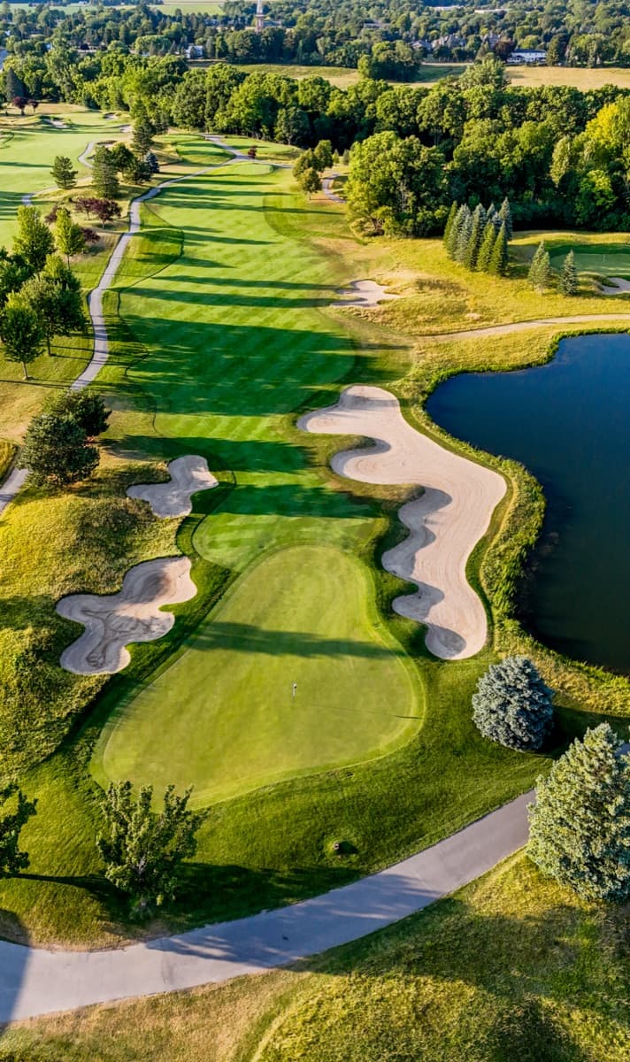 Vertical aerial of the 5th hole at The Fortress, green and bunkers below the fairway